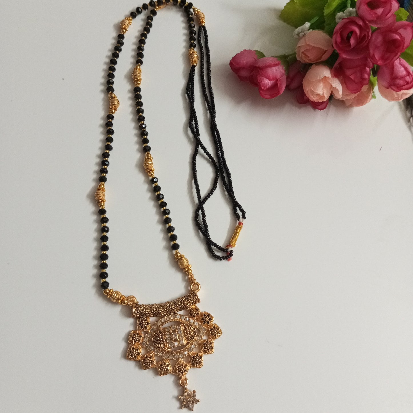 Cz Studded Golden Long Mangalsutra with engraved flowers design