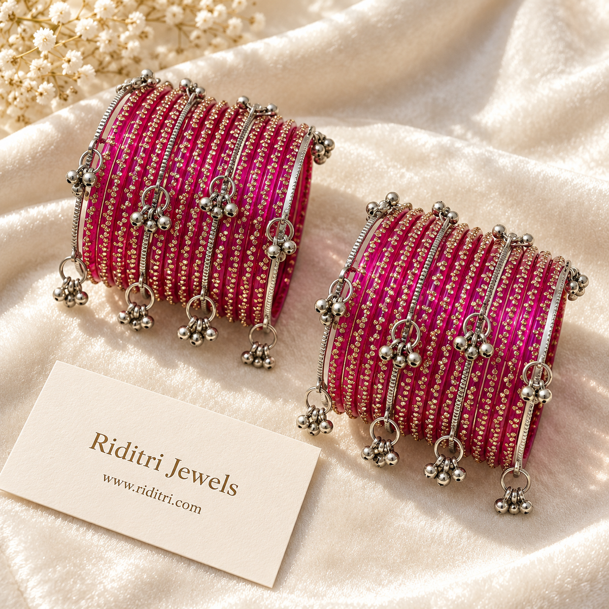 Close view of rani pink gold dot glass bangles with Kashmiri ghungroo