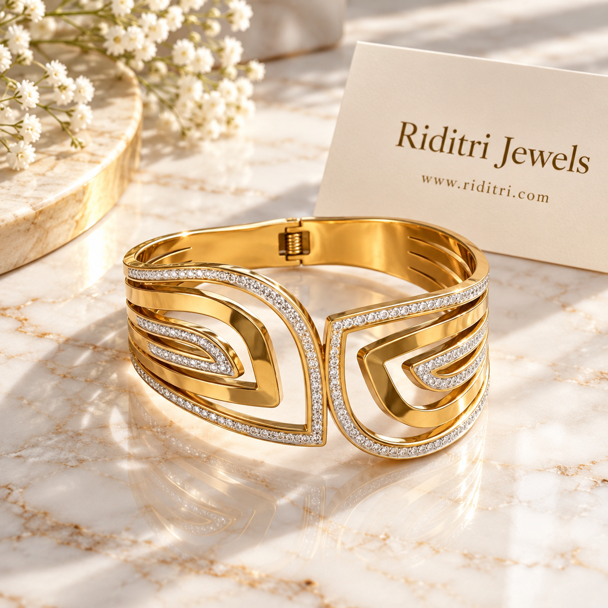 Detail of Aura Echo concentric gold curves outlined in CZ stones