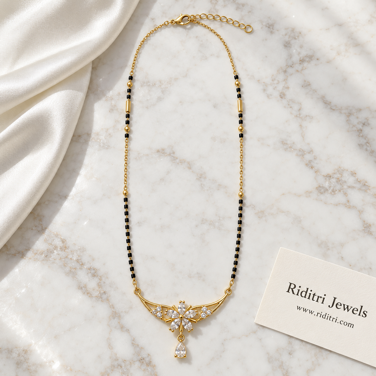 Square black bead mangalsutra chain with gold tube beads and flower drop pendant