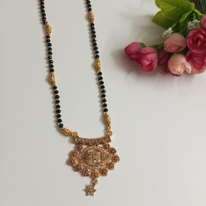 Cz Studded Golden Long Mangalsutra with engraved flowers design