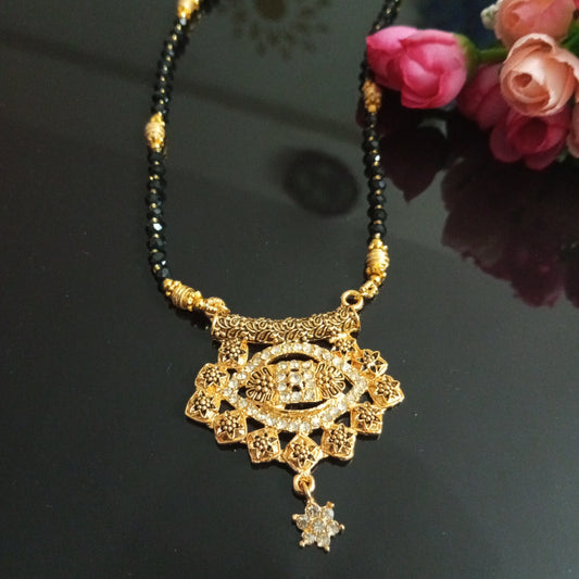 Cz Studded Golden Long Mangalsutra with engraved flowers design