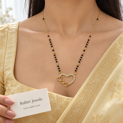 Round black bead mangalsutra chain with gold beads and heart pendant