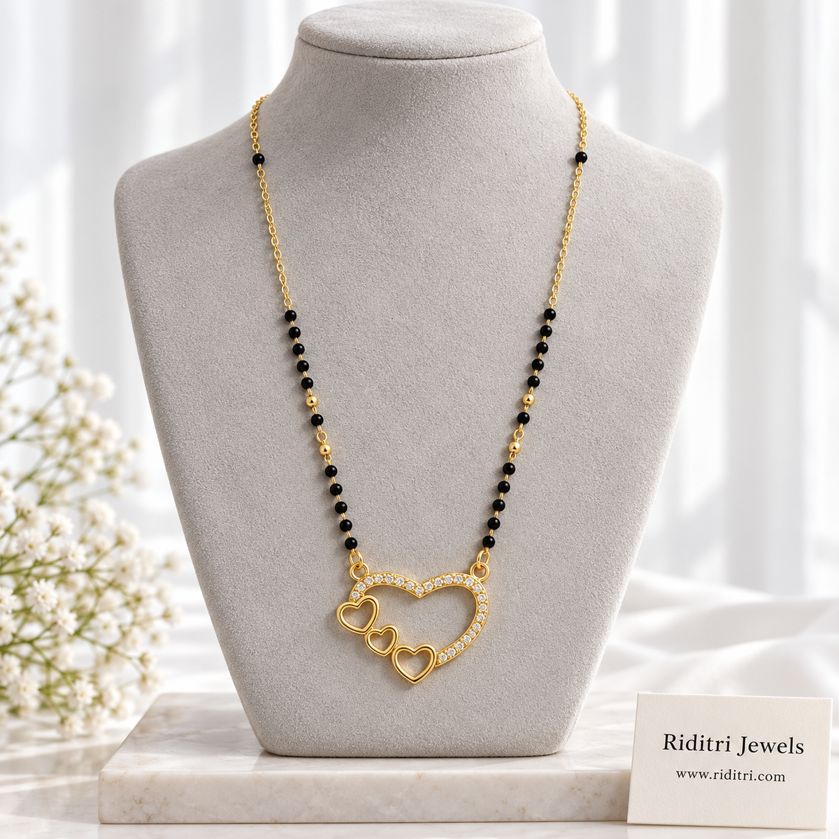 Aashna anti-tarnish open heart mangalsutra with AD stone heart and three little gold hearts