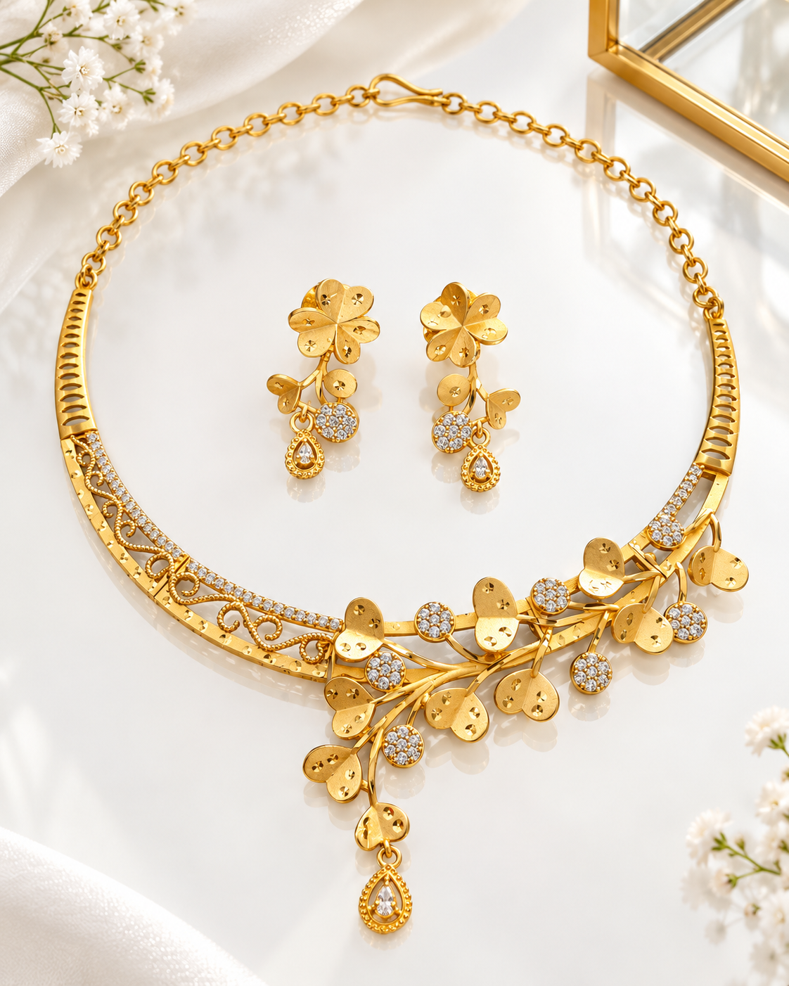 Woman wearing gold plated hasli-style vine necklace and flower drop earrings with a saree