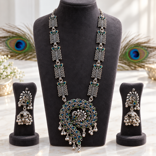 Morpankh oxidised long necklace set with large peacock pendant, peacock feather enamel links, ghungroo drops and matching jhumka earrings by Riditri