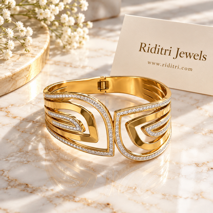 Detail of Aura Echo concentric gold curves outlined in CZ stones