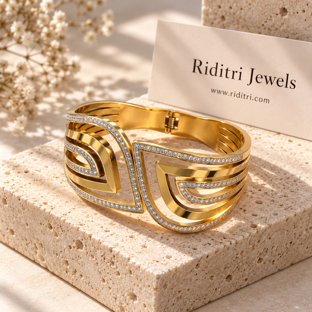 Aura Echo gold-toned anti-tarnish bracelet with mirrored CZ-outlined teardrops