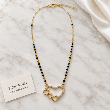 Gold-toned open heart mangalsutra pendant lined with sparkling stones