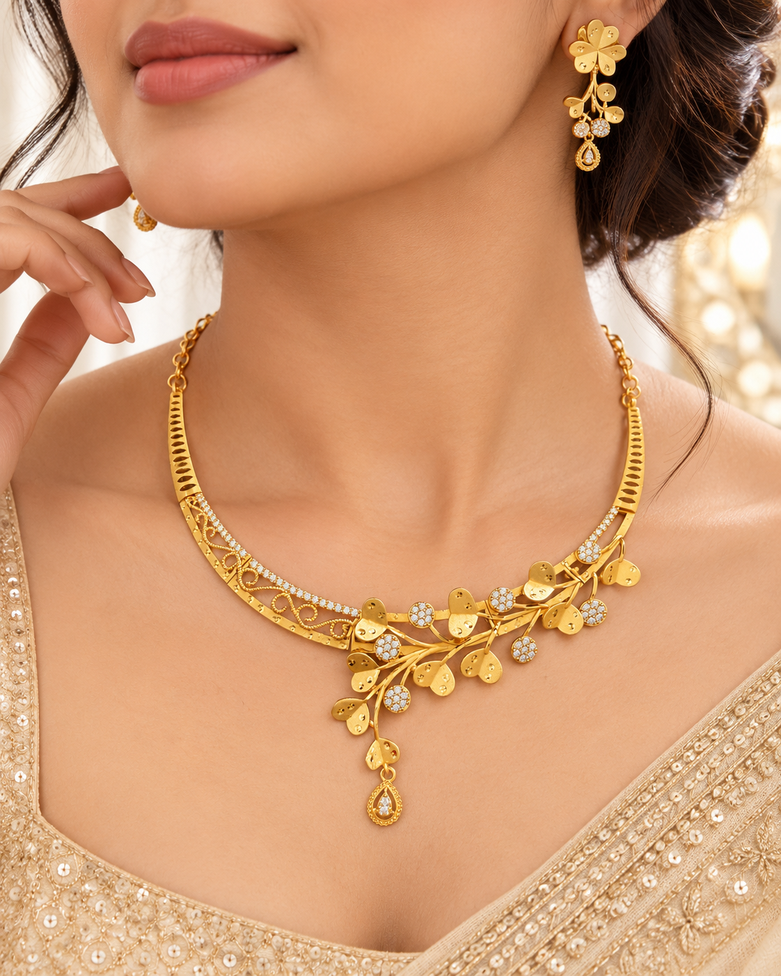 Gold plated collar necklace with heart-shaped leaves, filigree scrolls and teardrop drop