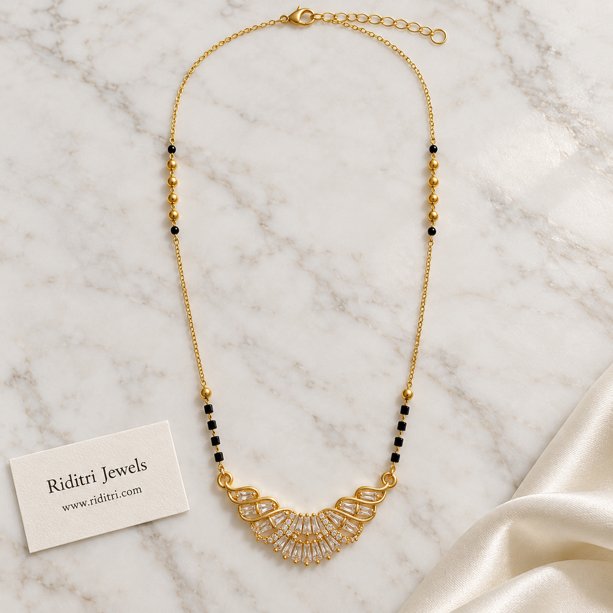 Black bead mangalsutra chain with gold beads and diamond-look baguette pendant