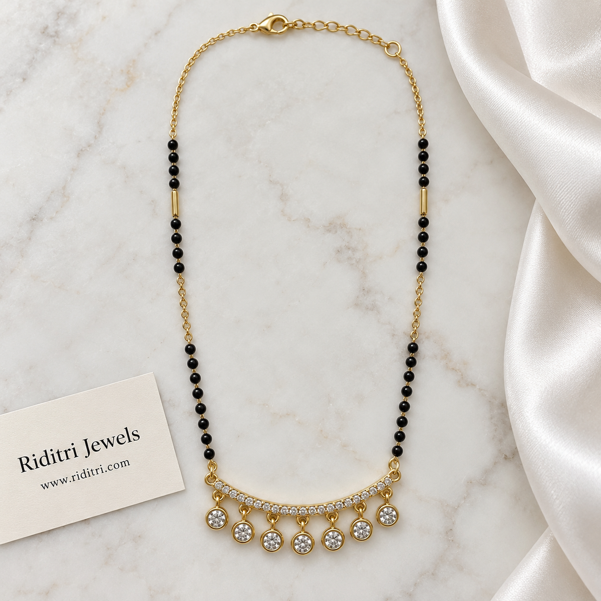 Round black bead mangalsutra chain with gold bar beads and solitaire drop pendant