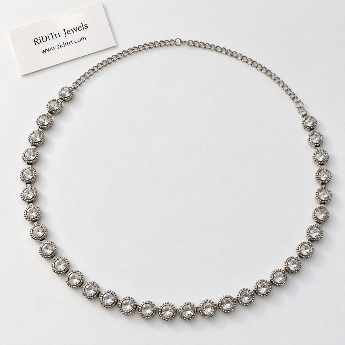 Free size silver-toned waist chain with round clear crystal-look stones and long adjustable chain, view 2