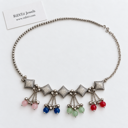 Engraved oxidised diamond motifs with pink, blue, green and red stone tassels and ghungroo bells, view 2