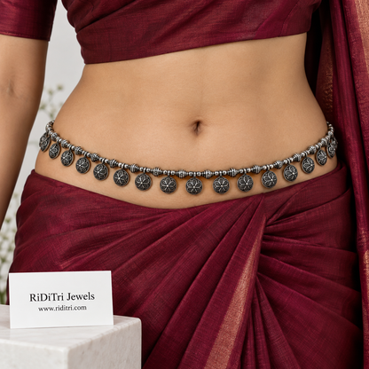 Oxidised flower coin waist belt (kamarbandh) by Riditri in silver-toned finish