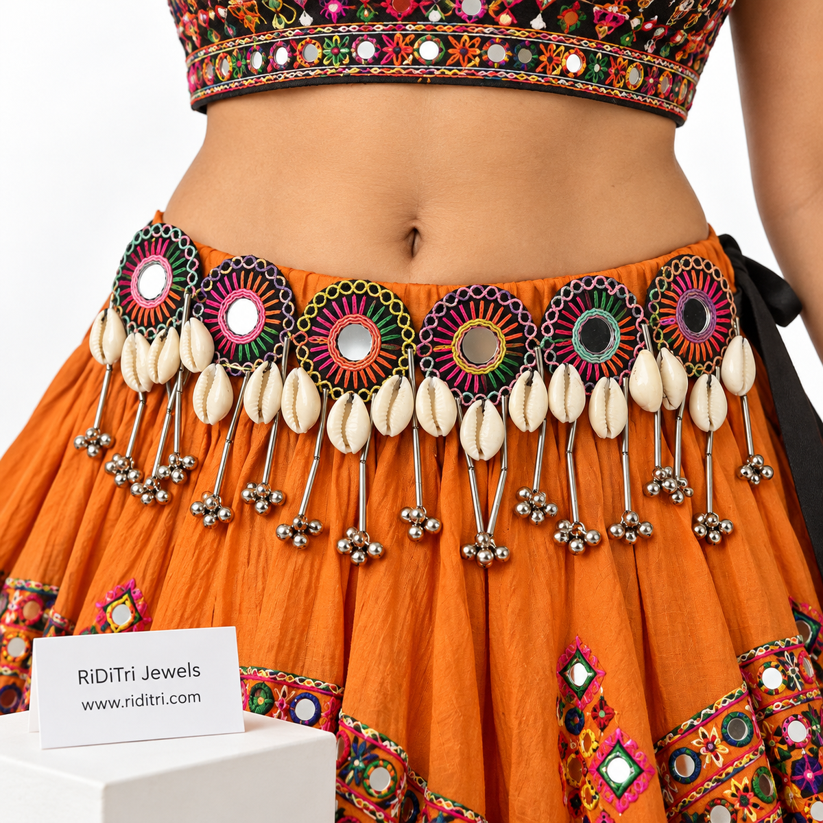 Round mirror cowrie ghungroo Navratri kamarbandh by Riditri with multicolour embroidery