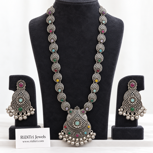 Jaali oxidised long necklace set with lattice-engraved links, multicolour stones, ghungroo fringe pendant and matching earrings by Riditri