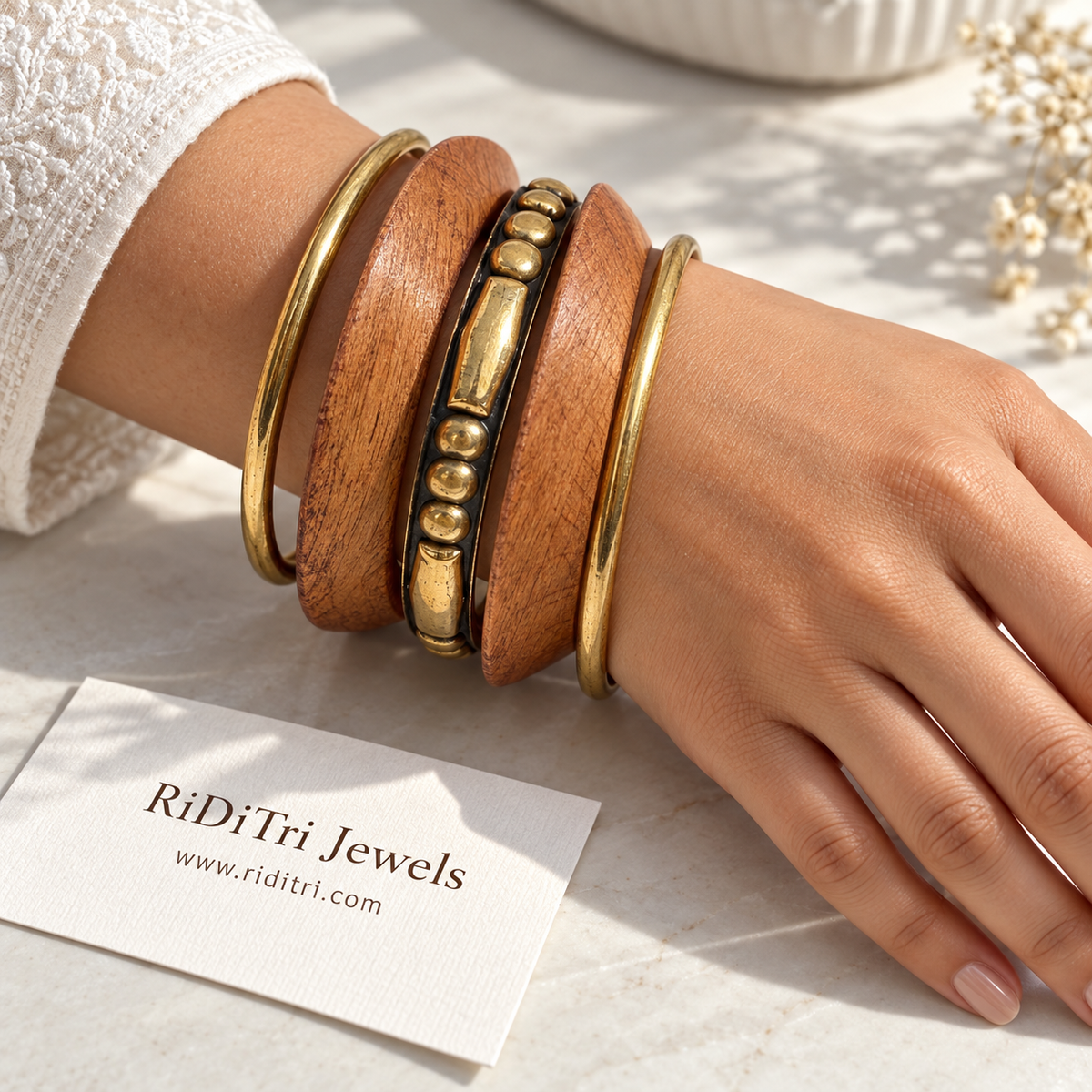 Vanya boho bangle set of 5 with two broad wooden bangles, two slim gold-toned bangles and a studded gold-toned centre bangle by Riditri