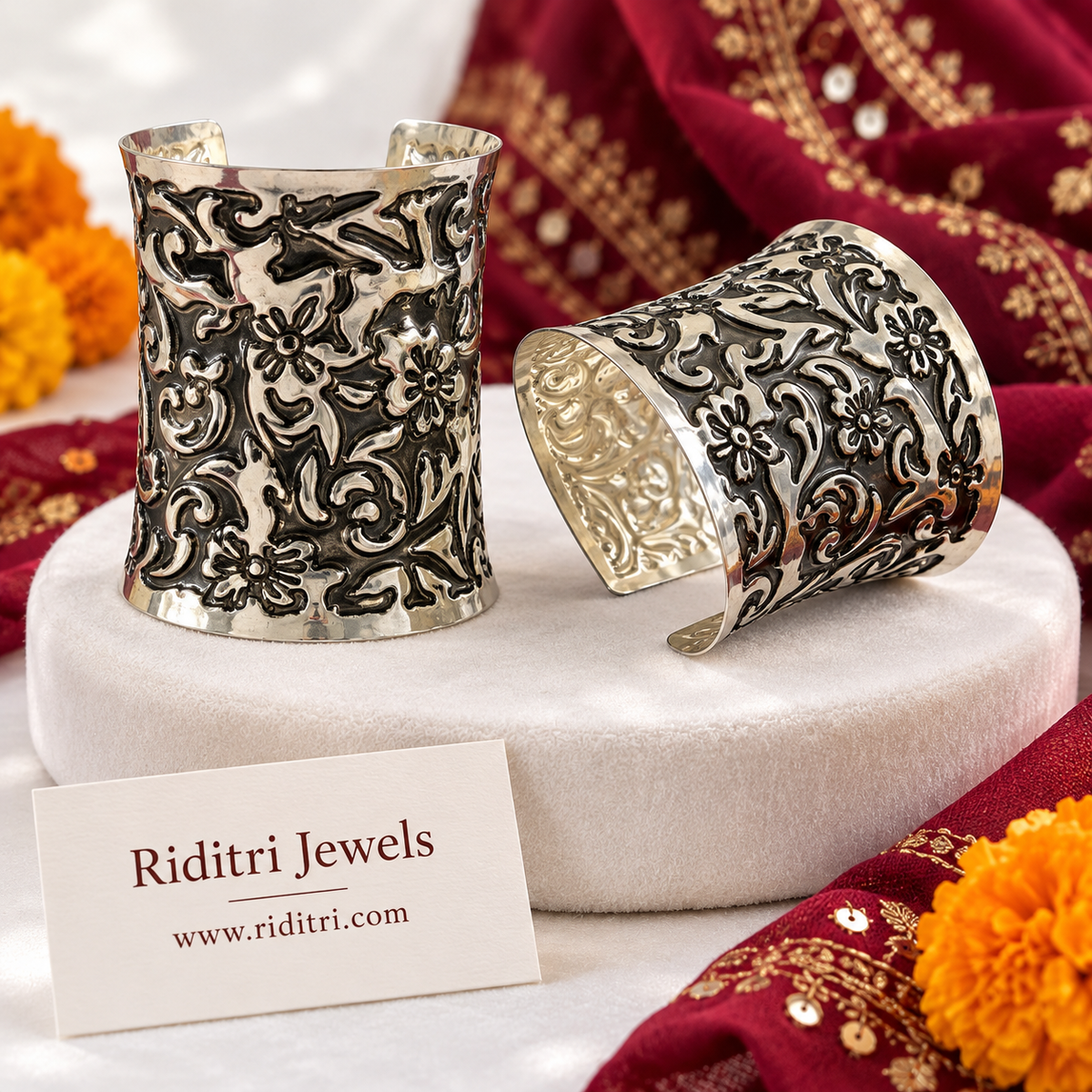 Phoolwari Adjustable Broad Cuff Bracelets – close-up of embossed flowers and swirls on the silver-toned oxidised cuff, view 3