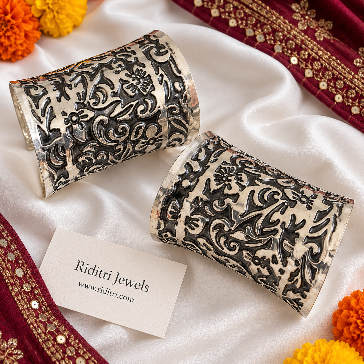 Phoolwari adjustable broad cuff bracelets pair with embossed floral and swirl pattern in two-tone oxidised finish by Riditri