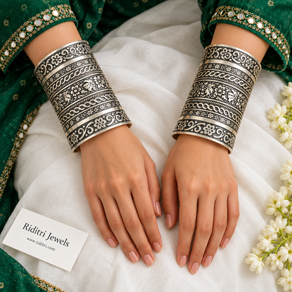 Rajwadi Adjustable Broad Cuff Bracelets – close-up of floral and rope band pattern on the silver-toned open cuffs, view 2
