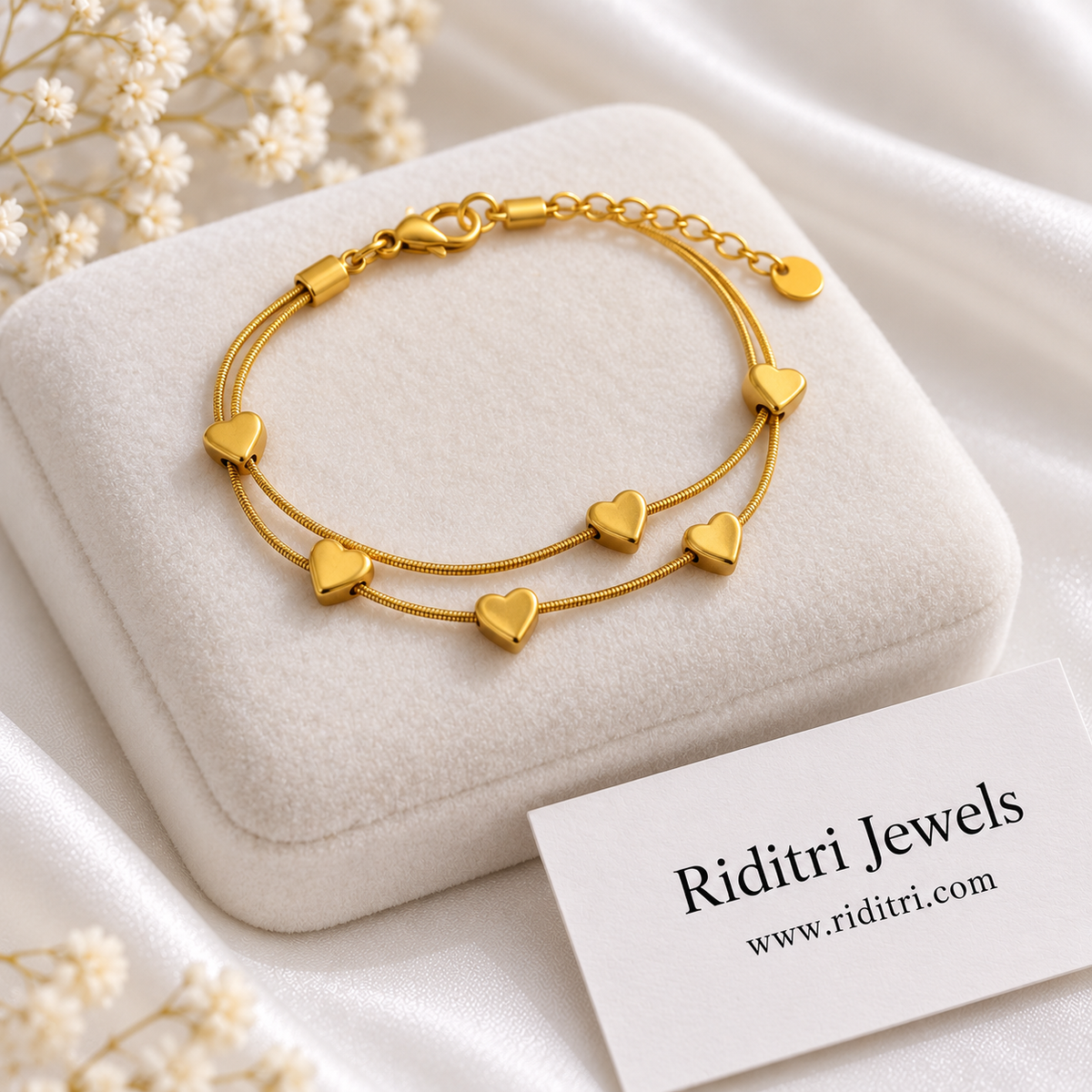 Anti tarnish stainless steel double heart bracelet with two gold-toned snake chains and tiny heart charms by Riditri