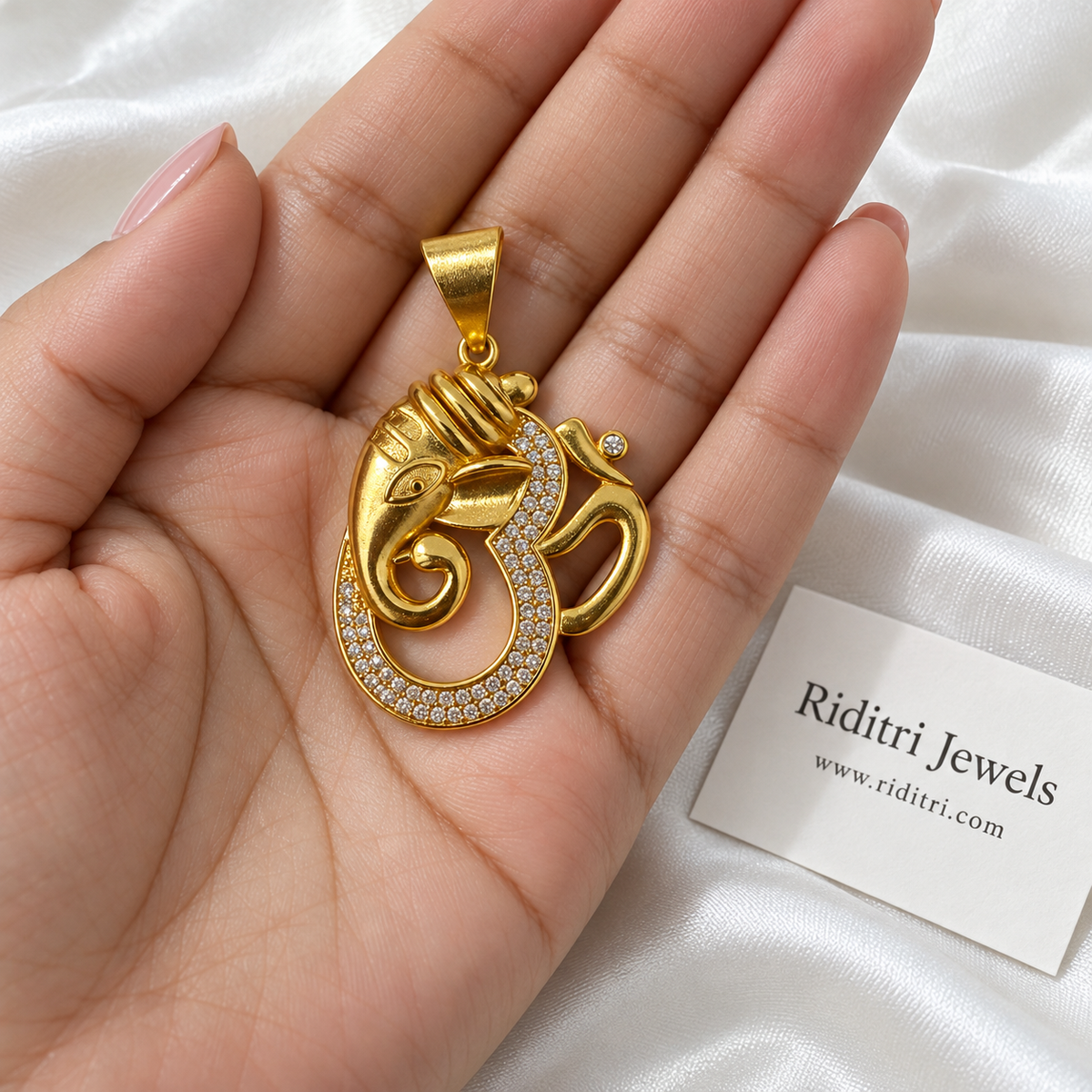 Om Ganesha Gold Pendant – close-up of gold-toned Ganesha and Om design with white stones and wide bail, view 2