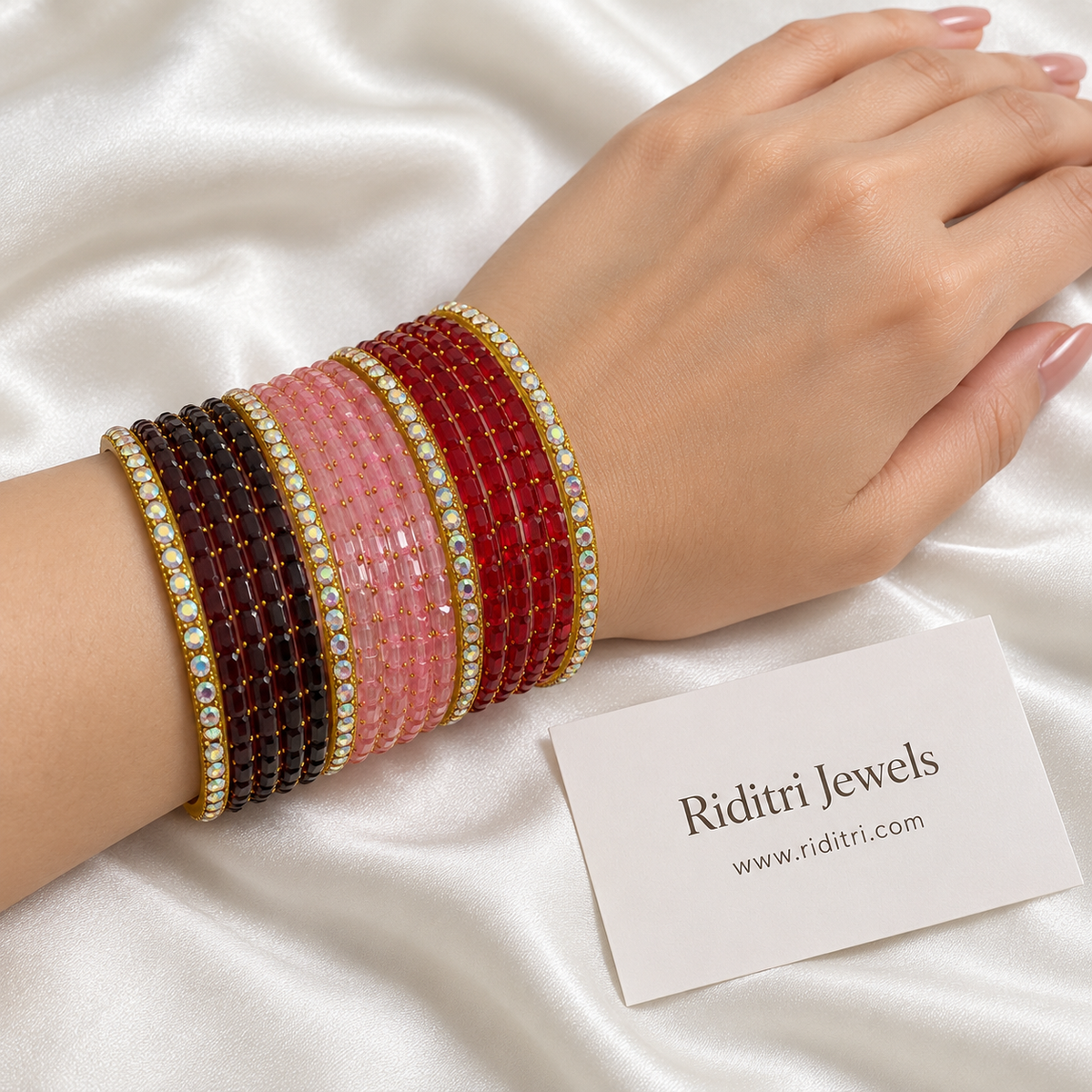 Maroon, pink and red stone bangle set with golden rainbow-sparkle bangles – 32 pieces for both hands by Riditri