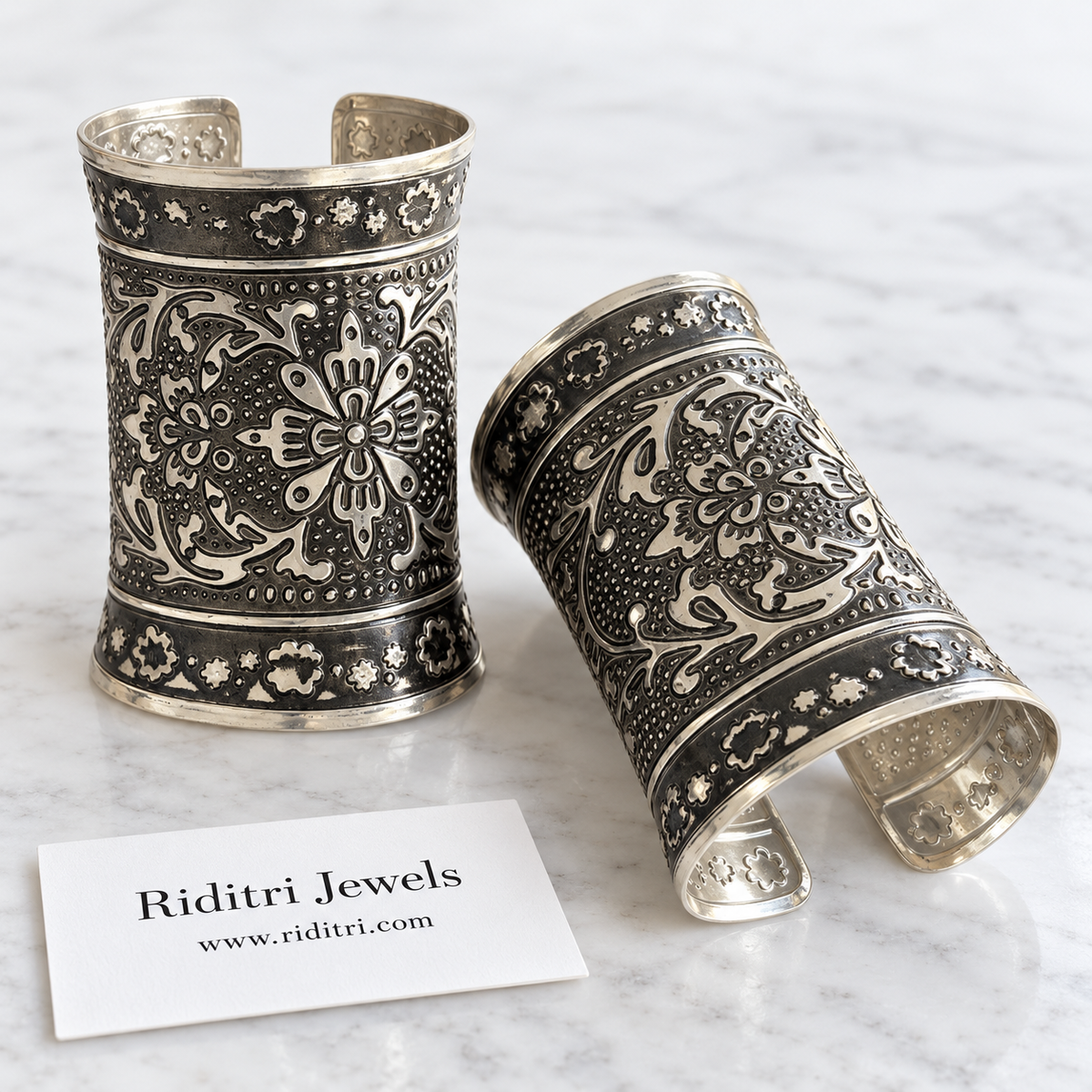 Gul Bahar Adjustable Broad Cuff Bracelets – close-up of the oxidised flower design and blossom border bands, view 2