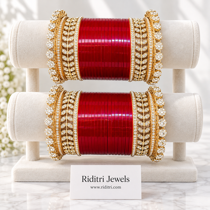 Red Bridal Chooda Set – matched pair on ivory satin with rose petals, sparkling AD stone leaf-pattern kadas, view 3