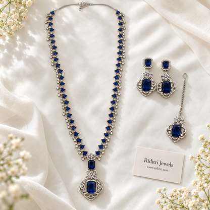 Silver-toned long necklace set with royal blue and clear stones by Riditri Jewels