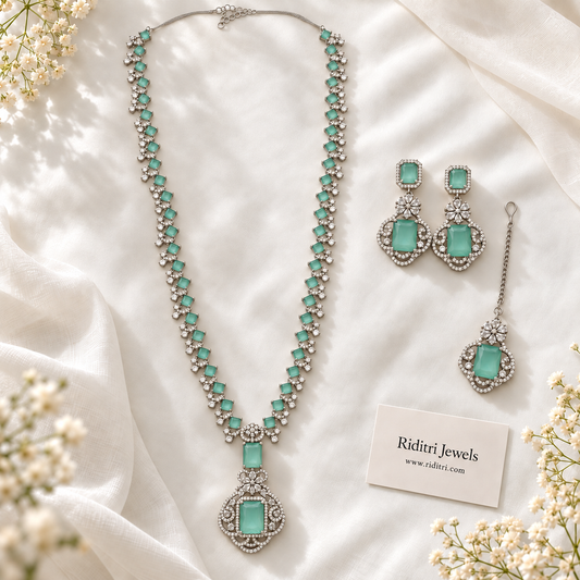 Nita Ambani inspired mint green silver necklace set with long necklace, drop earrings and maang tika