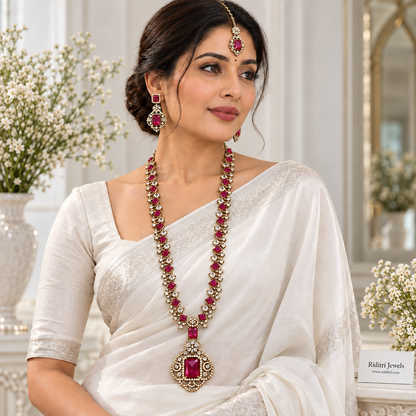 Gold-toned long necklace set with ruby red and clear stones by Riditri Jewels