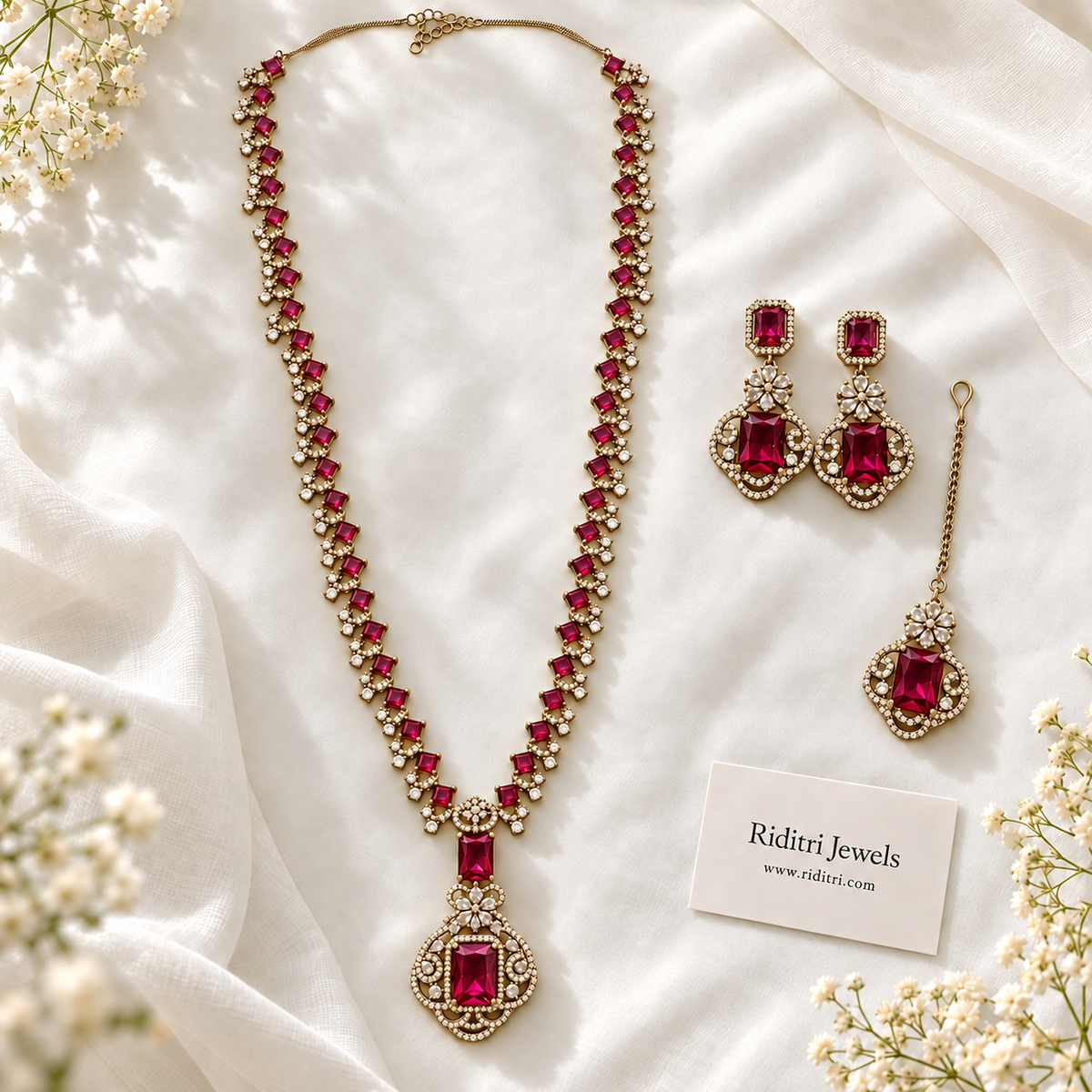 Ruby red stone pendant with clear AD-style stones on gold-toned long necklace