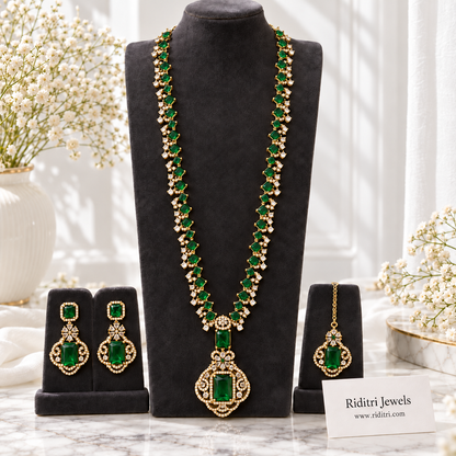 Emerald green stone pendant with clear AD-style stones on gold-toned long necklace