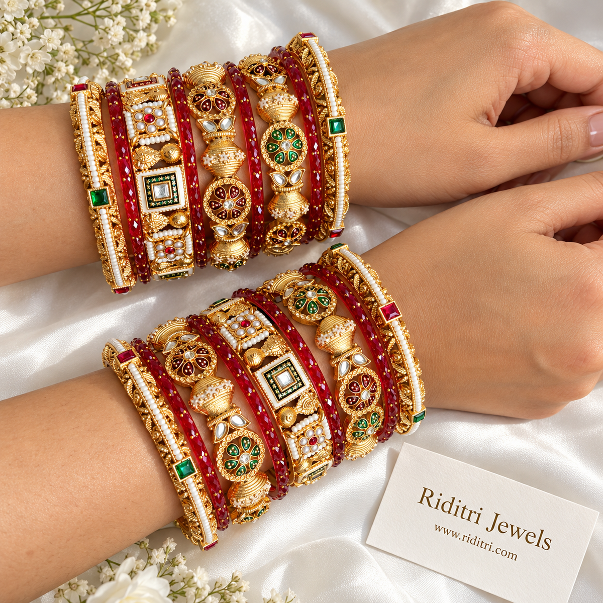 Red and gold Rajwadi bangle stack worn on both hands with meenakari and pearl detailing