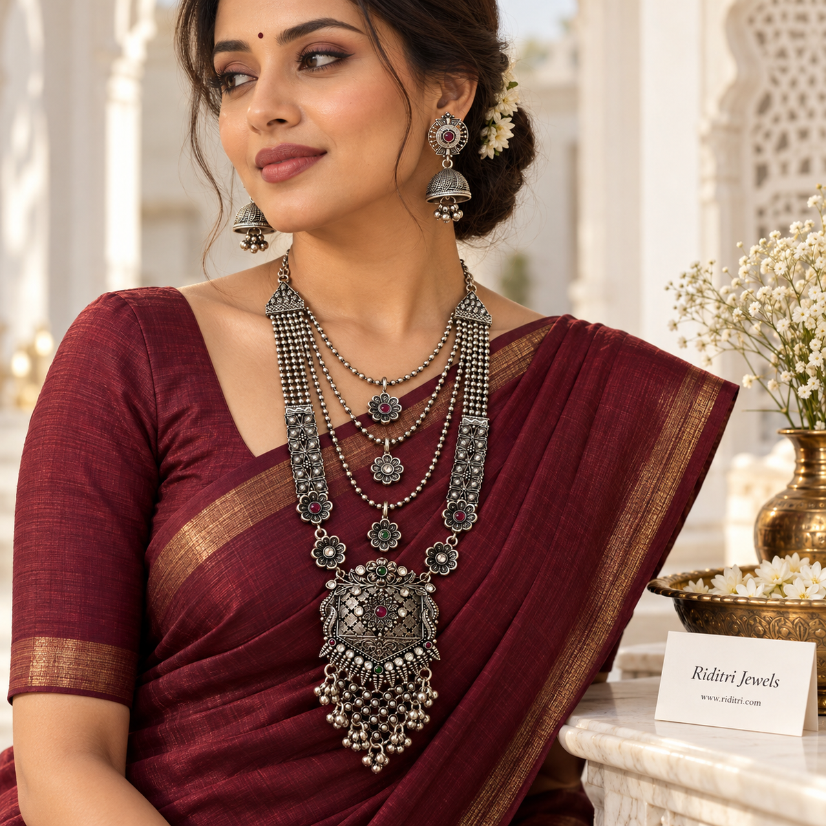 Layered oxidised long necklace with bead chains, flower charms and ghungroo fringe by Riditri