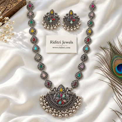 Oxidised twin peacock pendant with multicolour stone flower and ghungroo fringe