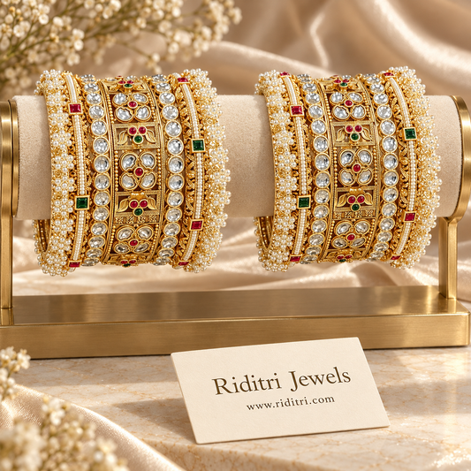 Rajwadi kundan moti bangle set with pearl clusters and ruby green stones in antique gold finish