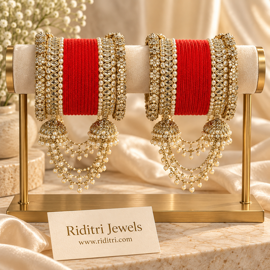 Red velvet bridal bangle set with reverse AD stone kadas, pearl borders and jhumka latkans