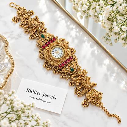 Airavat antique gold plated Kashmiri ghungroo watch with royal elephants and ruby green stones