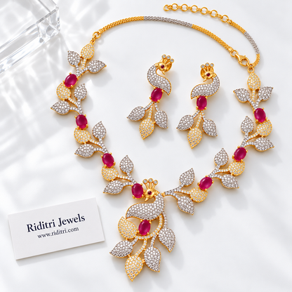 Silver and gold two-tone peacock leaf necklace with ruby red stones for receptions