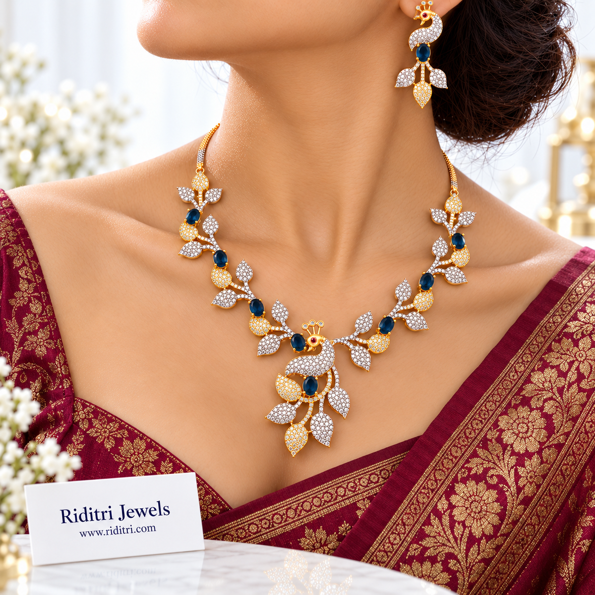 Blue stone AD peacock earrings with silver and gold leaf drops