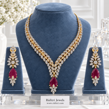 Inaaya two-tone AD leaf necklace set with ruby red teardrop stone and matching earrings