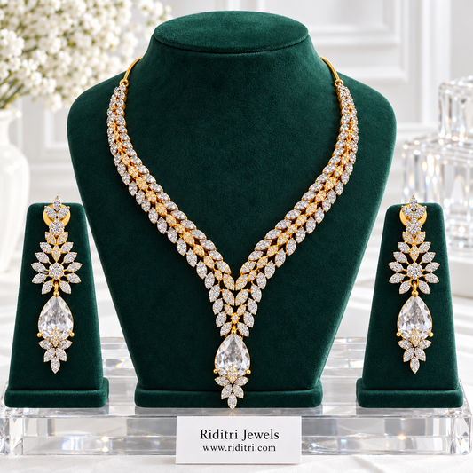 Inaaya two-tone AD leaf necklace set with clear white teardrop stone and matching earrings