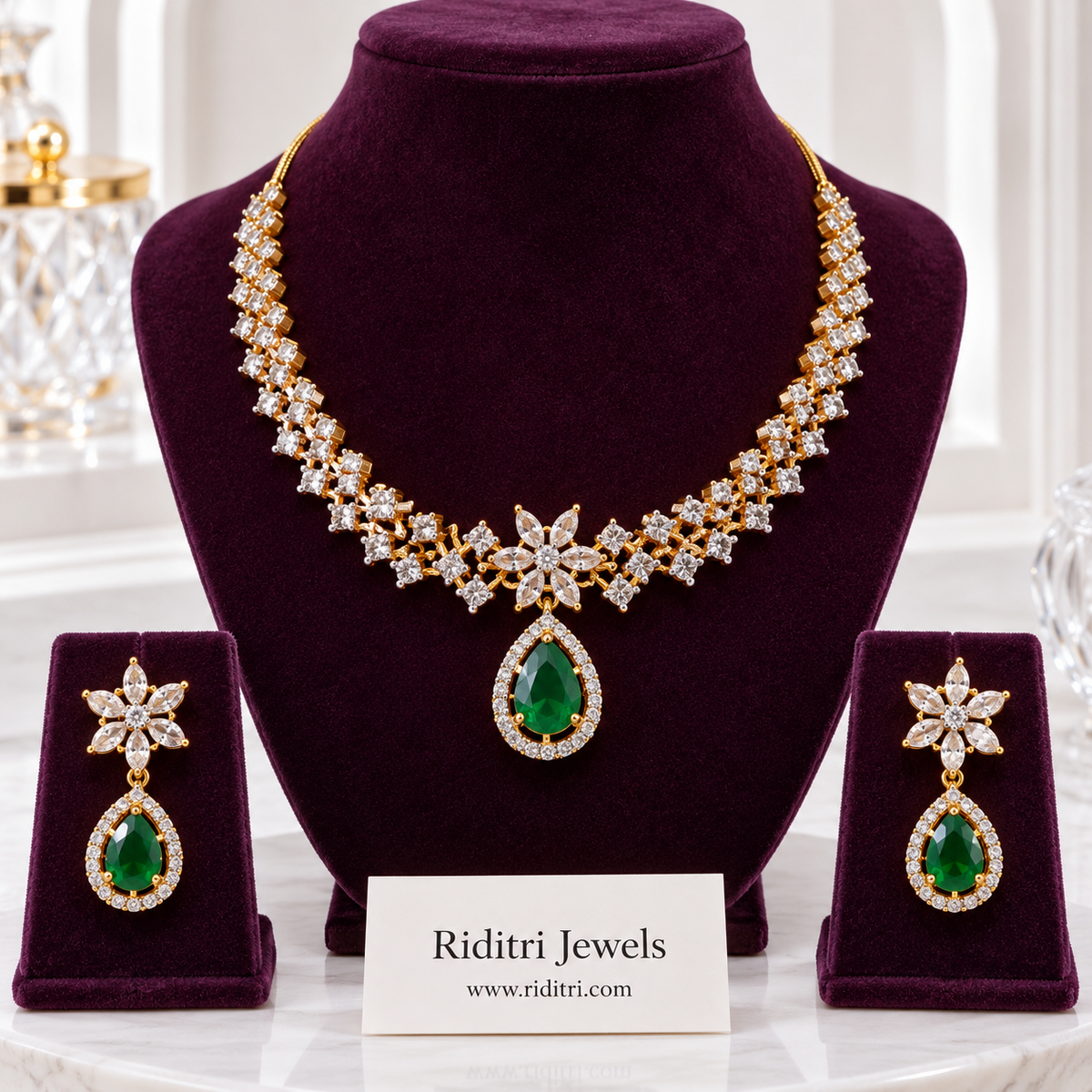 Sitara gold-toned AD stone necklace set with emerald green teardrop pendant and earrings