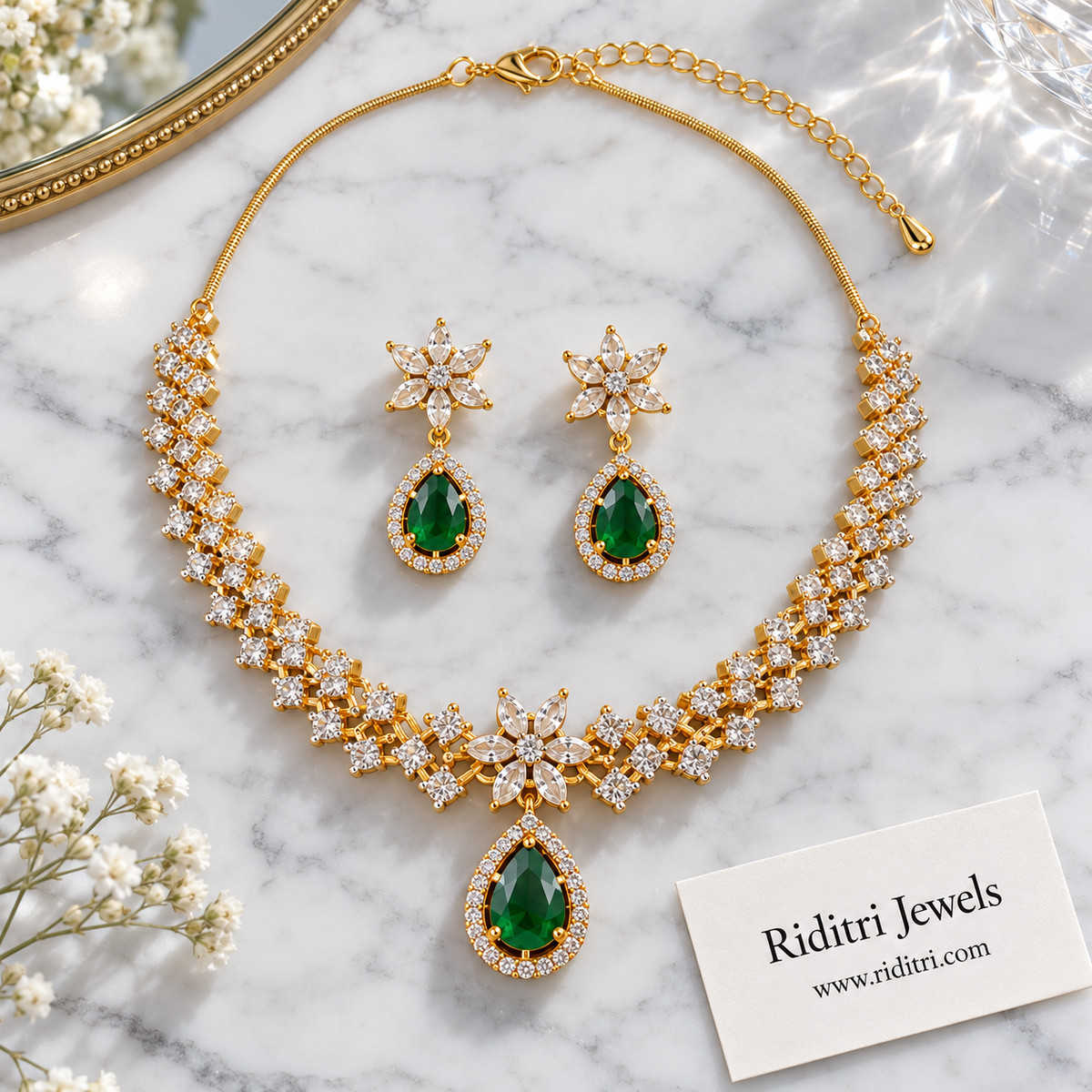 Zig-zag AD stone necklace with star flower centre and emerald green teardrop