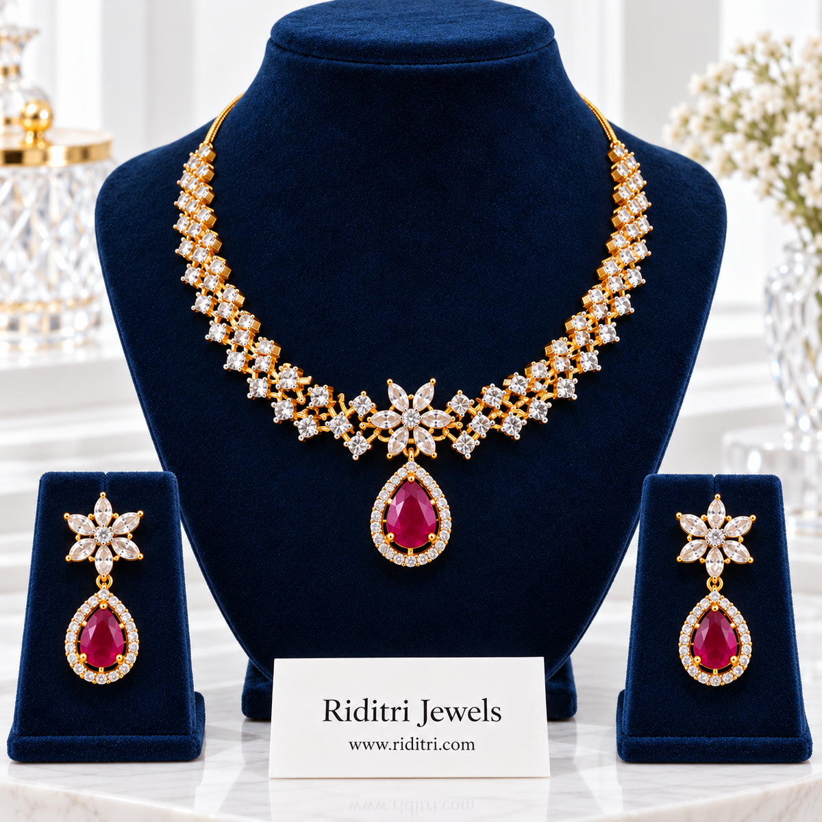 Sitara gold-toned AD stone necklace set with ruby red teardrop pendant and earrings