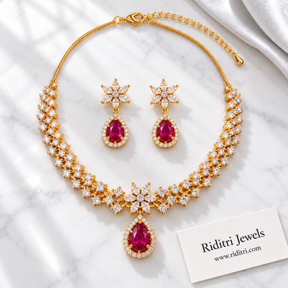 Close view of ruby teardrop pendant with halo of white stones