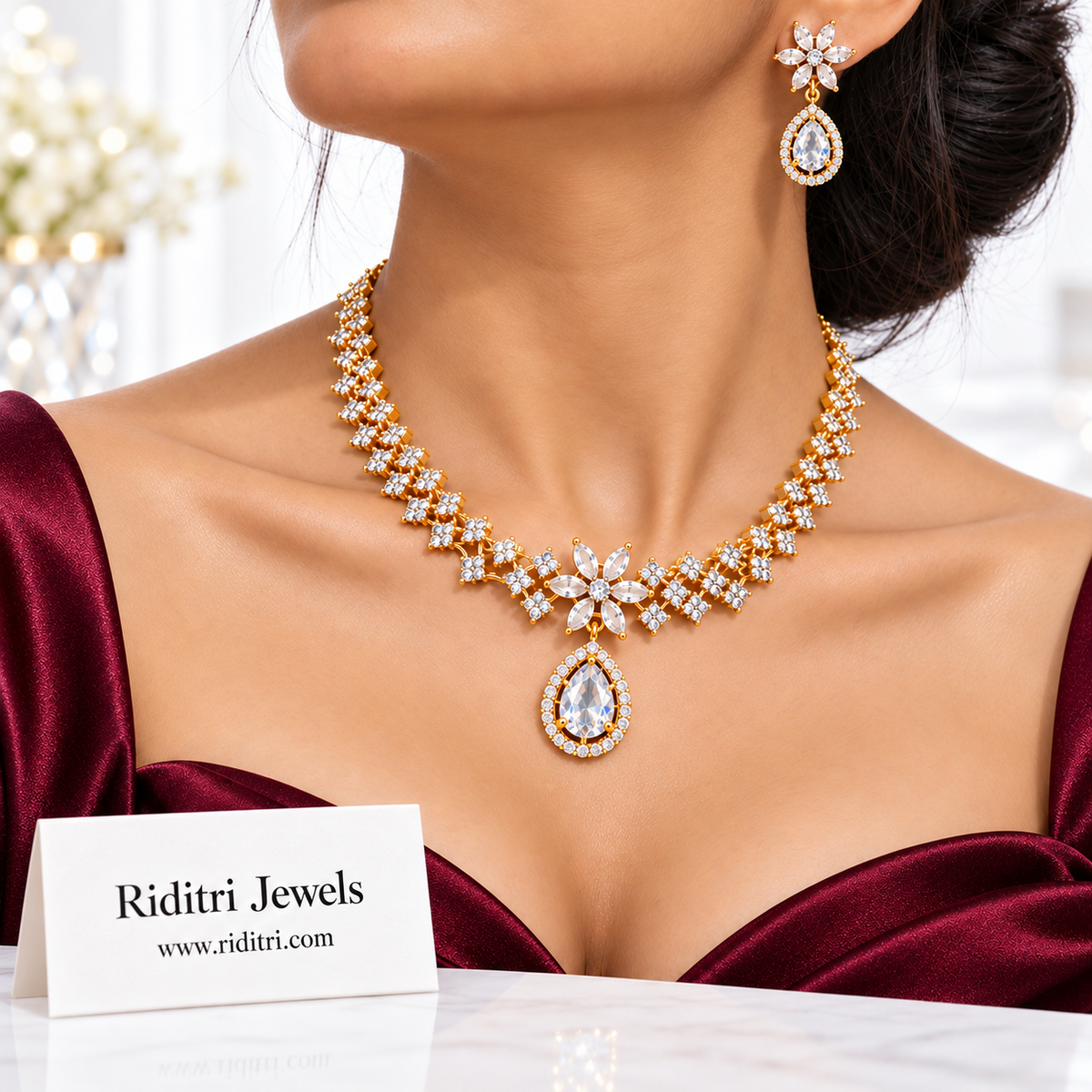 Sitara gold-toned AD stone necklace set with clear white teardrop pendant and earrings